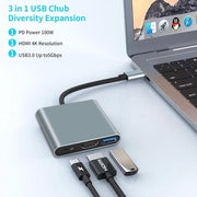 3-in-1 USB hub with laptop and cables on a light background